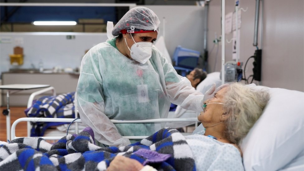 A nurse speaks to a Covid patient in Santo Andre, Sao Paulo state, Brazil, January 1, 2021